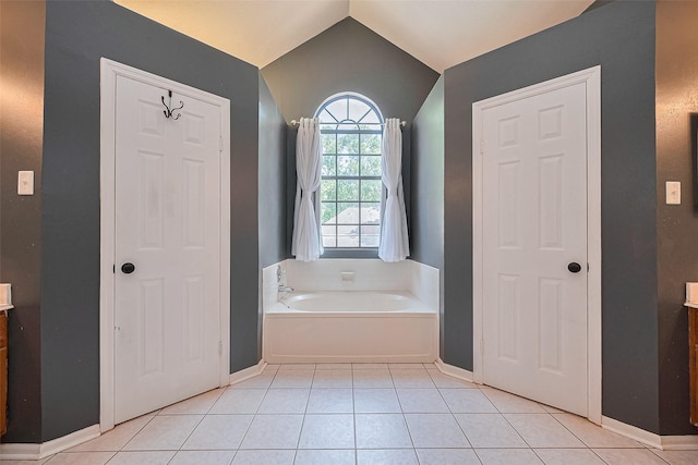3718 Sweetgum Hill Ln, Houston, TX 77345 - bathroom with a garden tub, tile patterned floors, lofted ceiling, baseboards, and vanity