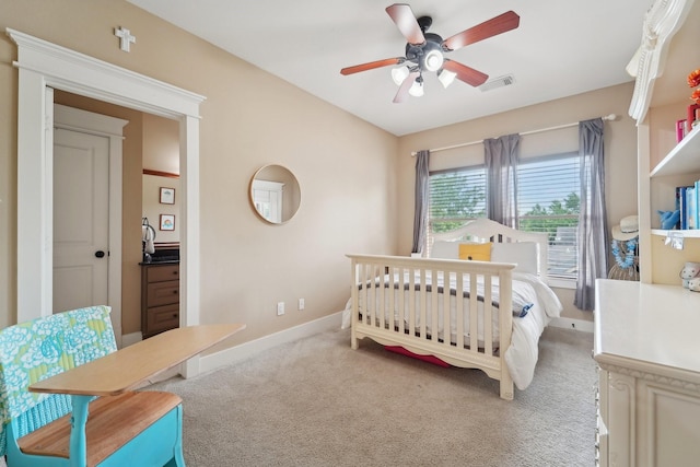 121 E 22nd St, Houston, TX 77008 - bedroom featuring carpet floors, baseboards, ceiling fan, and a crib
