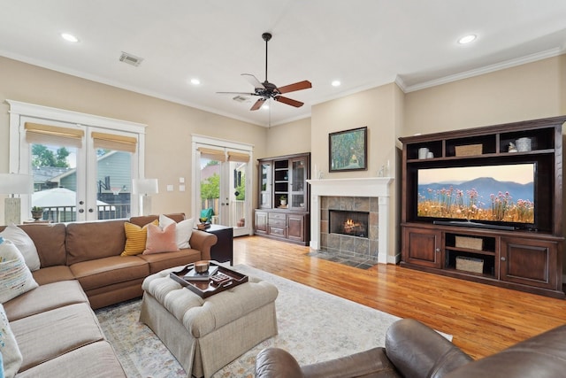 121 E 22nd St, Houston, TX 77008 - living area with light wood-style flooring, french doors, recessed lighting, ceiling fan, and crown molding