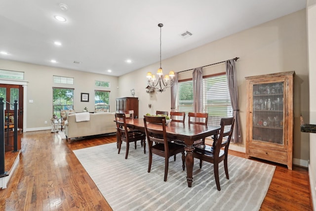 121 E 22nd St, Houston, TX 77008 - dining room with wood finished floors, recessed lighting, a chandelier, and baseboards