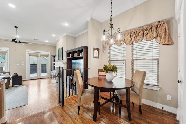 121 E 22nd St, Houston, TX 77008 - dining area featuring wood finished floors, crown molding, french doors, baseboards, and ceiling fan