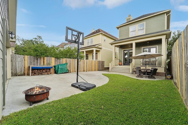 121 E 22nd St, Houston, TX 77008 - rear view of property with a fire pit, a patio, and a chimney