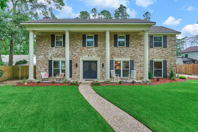 6411 Elmgrove Rd, Spring, TX 77389 - greek revival house featuring a porch and brick siding