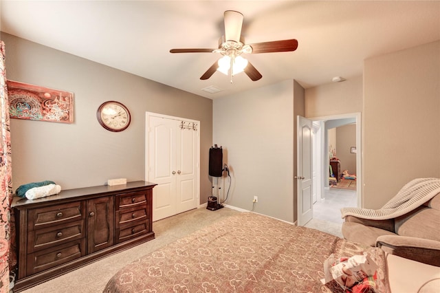 6119 Cresting Knolls Cir, Richmond, TX 77407 - bedroom with light colored carpet, ceiling fan, and a closet