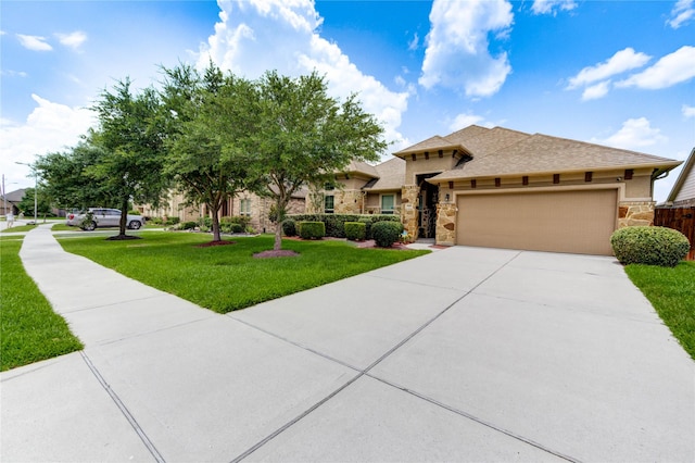 6119 Cresting Knolls Cir, Richmond, TX 77407 - view of front of house with stone siding, concrete driveway, a garage, and stucco siding