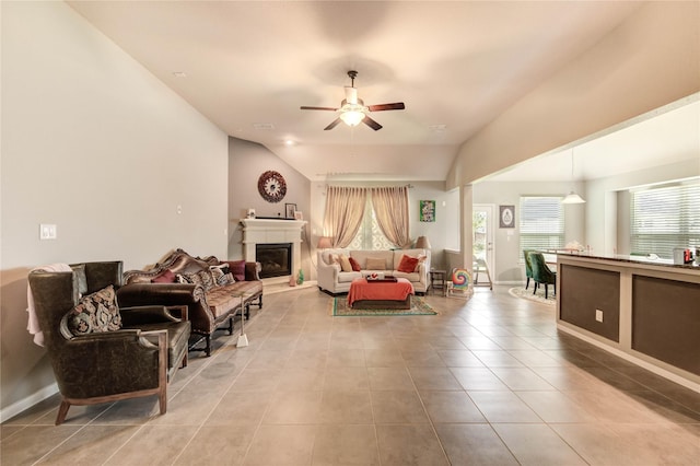 6119 Cresting Knolls Cir, Richmond, TX 77407 - tiled living area featuring a ceiling fan, a glass covered fireplace, and lofted ceiling
