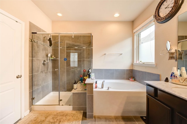 6119 Cresting Knolls Cir, Richmond, TX 77407 - bathroom featuring a bath, a shower stall, vanity, recessed lighting, and tile patterned floors