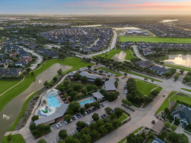6815 Cottonwood Crest Ln, Katy, TX 77493 - aerial view at dusk of a water view, view of pool area, and a residential view