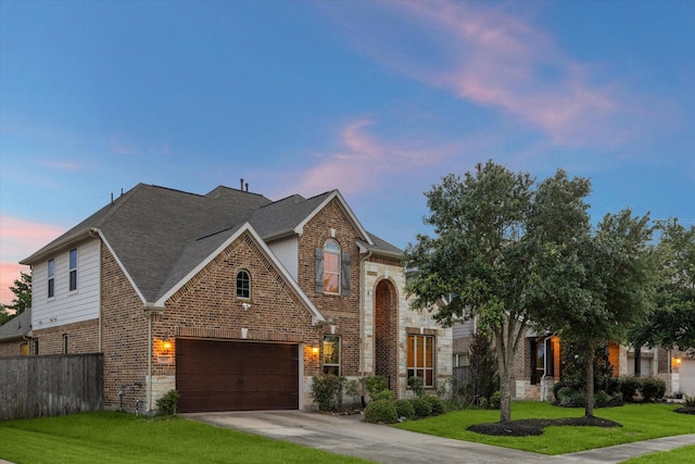 6815 Cottonwood Crest Ln, Katy, TX 77493 - view of front of home featuring brick siding, driveway, an attached garage, and roof with shingles
