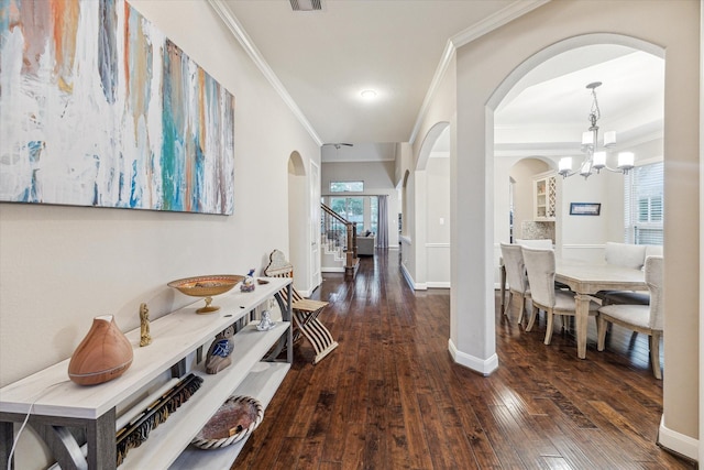 6815 Cottonwood Crest Ln, Katy, TX 77493 - corridor featuring arched walkways, ornamental molding, a chandelier, hardwood / wood-style flooring, and baseboards