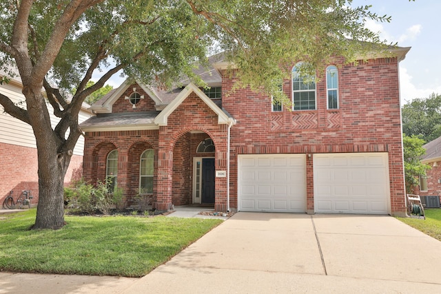 3526 Azalea Sands Dr, Spring, TX 77386 - traditional-style home featuring brick siding, a garage, concrete driveway, and a front lawn
