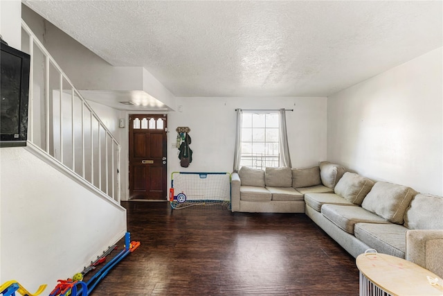7322 Crownwest St Unit 7322, Houston, TX 77072 - living room with wood finished floors, a textured ceiling, and stairway