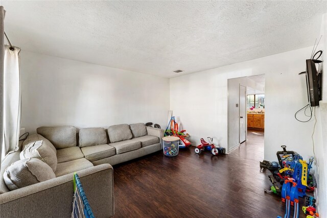 7322 Crownwest St Unit 7322, Houston, TX 77072 - living room featuring wood finished floors and a textured ceiling