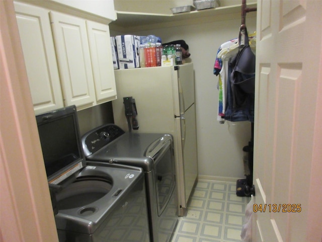 15014 Redbud Leaf Ln, Cypress, TX 77433 - laundry area with tile patterned floors, cabinet space, and separate washer and dryer