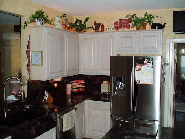 15014 Redbud Leaf Ln, Cypress, TX 77433 - kitchen with refrigerator with ice dispenser, a sink, white cabinets, dark countertops, and dishwasher