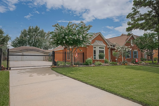 15014 Redbud Leaf Ln, Cypress, TX 77433 - view of front of home with concrete driveway, brick siding, and a gate