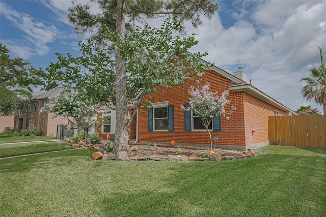15014 Redbud Leaf Ln, Cypress, TX 77433 - view of front of property featuring brick siding and a chimney