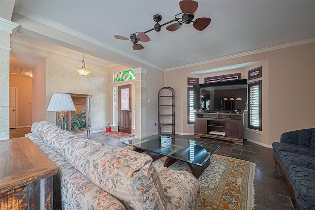 15014 Redbud Leaf Ln, Cypress, TX 77433 - living area featuring a ceiling fan, plenty of natural light, ornamental molding, and stone tile floors
