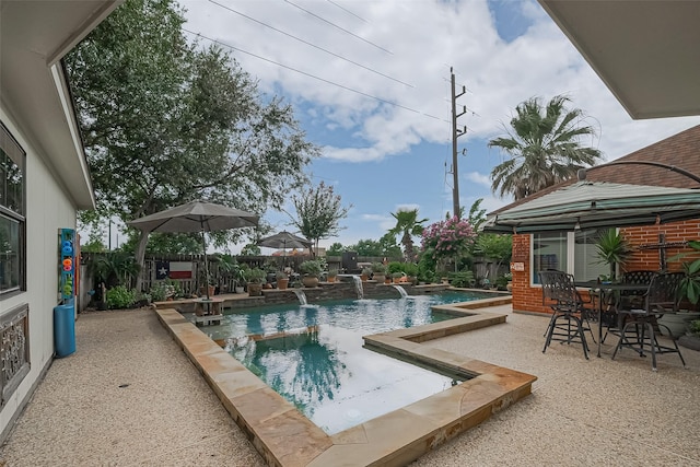 15014 Redbud Leaf Ln, Cypress, TX 77433 - view of swimming pool featuring a patio area, a fenced backyard, and a pool with connected hot tub