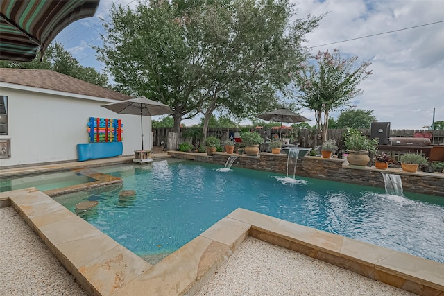 15014 Redbud Leaf Ln, Cypress, TX 77433 - view of swimming pool featuring a fenced backyard, grilling area, and a pool with connected hot tub