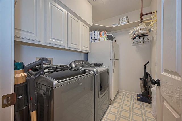 15014 Redbud Leaf Ln, Cypress, TX 77433 - washroom with cabinet space, washing machine and clothes dryer, and light floors