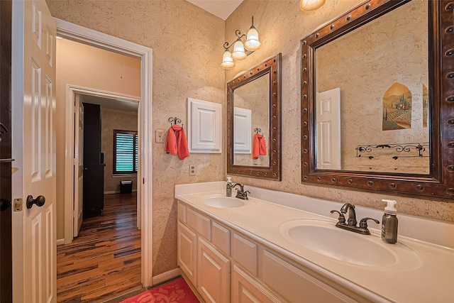 15014 Redbud Leaf Ln, Cypress, TX 77433 - bathroom featuring wood finished floors and double vanity