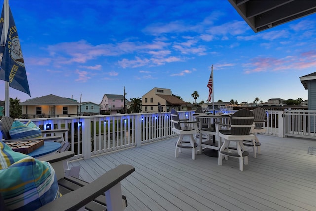 16710 Tahiti Way, Jamaica Beach, TX 77554 - wooden terrace with a residential view, outdoor dining space, and a water view