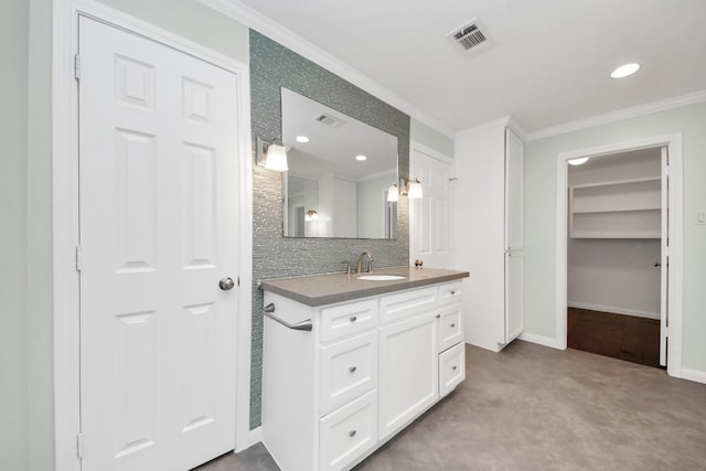 1010 Prince St, Houston, TX 77008 - bathroom with ornamental molding, vanity, backsplash, baseboards, and a walk in closet