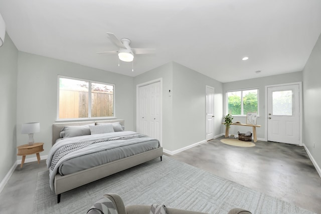 1010 Prince St, Houston, TX 77008 - bedroom featuring baseboards, finished concrete flooring, a ceiling fan, a closet, and recessed lighting