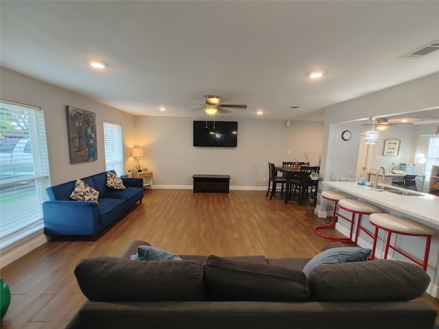 9711 Ebb St, Houston, TX 77089 - living area with a ceiling fan, wood finished floors, plenty of natural light, baseboards, and recessed lighting