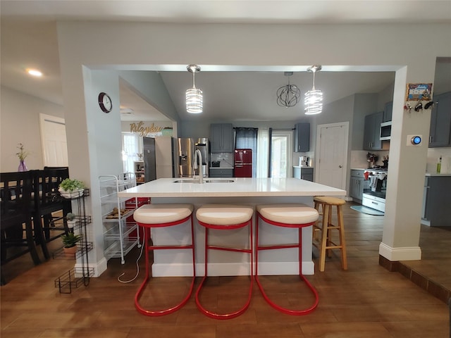 9711 Ebb St, Houston, TX 77089 - kitchen featuring a sink, light countertops, and a kitchen breakfast bar