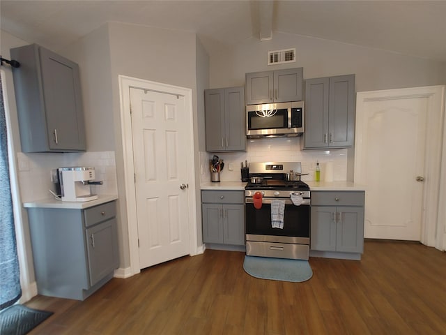 9711 Ebb St, Houston, TX 77089 - kitchen with appliances with stainless steel finishes, gray cabinets, dark wood finished floors, and light countertops