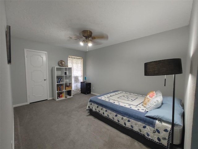 9711 Ebb St, Houston, TX 77089 - bedroom with baseboards, carpet, a ceiling fan, and a textured ceiling