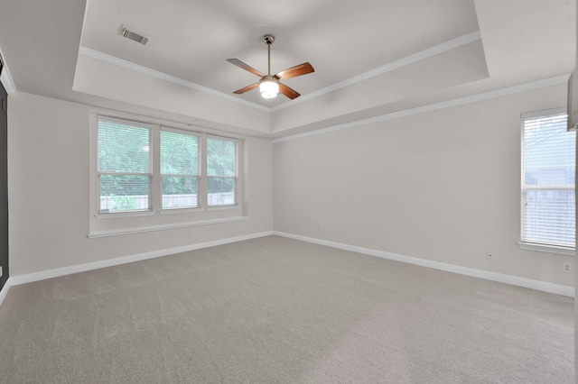 28315 Hollow Springs Ln, Spring, TX 77386 - empty room featuring a tray ceiling, a ceiling fan, carpet flooring, baseboards, and ornamental molding