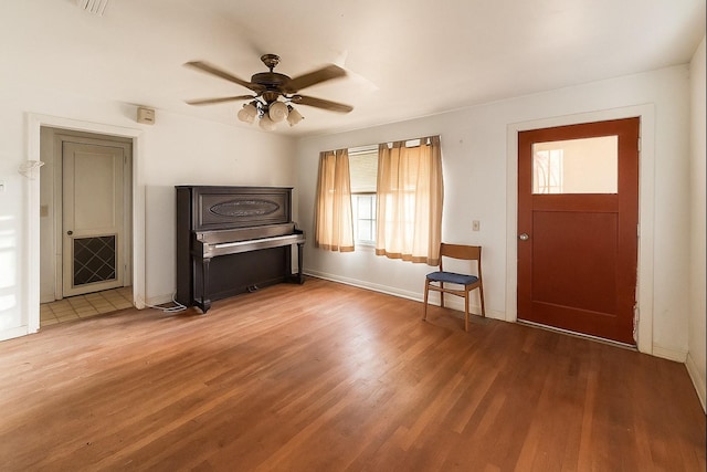 1002 Neiser Ln, Weimar, TX 78962 - entrance foyer with ceiling fan, wood finished floors, and baseboards