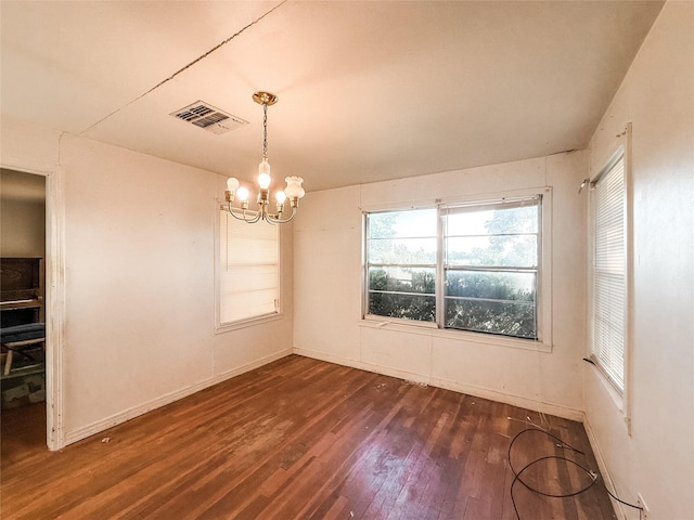 1002 Neiser Ln, Weimar, TX 78962 - unfurnished room with a chandelier, hardwood / wood-style floors, and baseboards