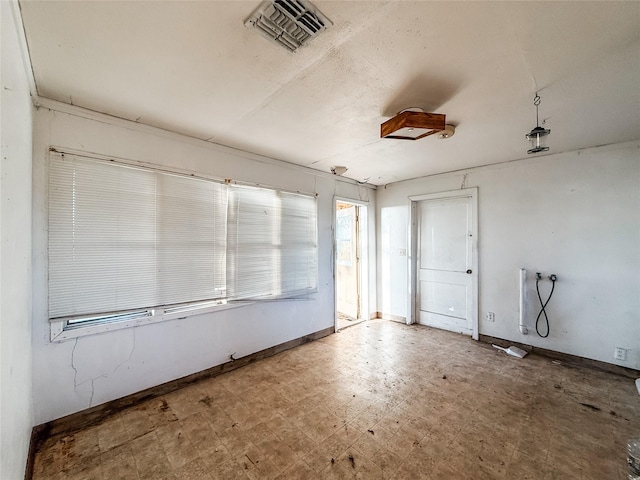 1002 Neiser Ln, Weimar, TX 78962 - unfurnished room featuring tile patterned floors and baseboards