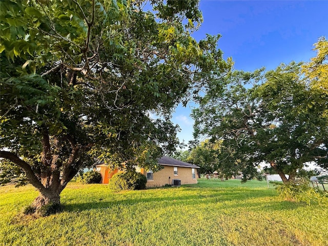 1002 Neiser Ln, Weimar, TX 78962 - view of grassy yard with central AC