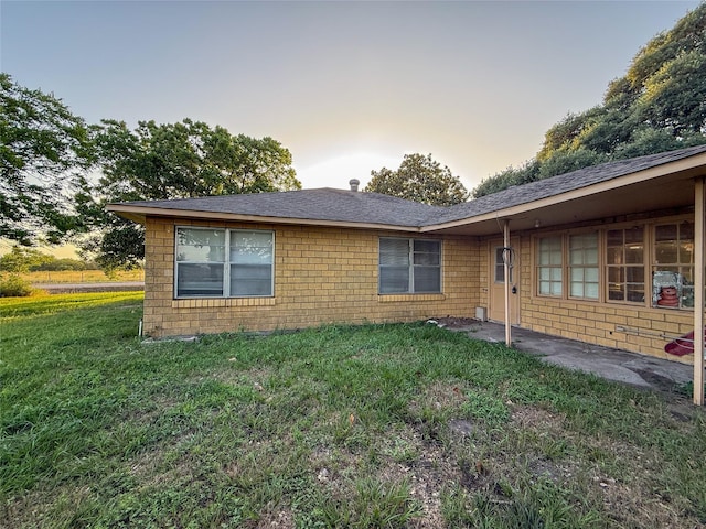 1002 Neiser Ln, Weimar, TX 78962 - view of property exterior with a lawn and roof with shingles