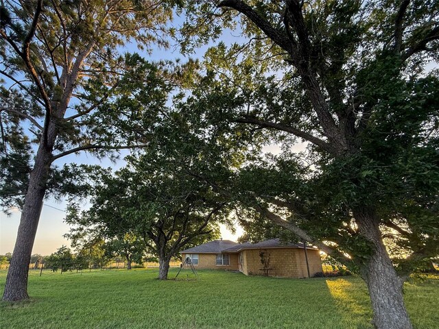 1002 Neiser Ln, Weimar, TX 78962 - yard at dusk featuring a yard