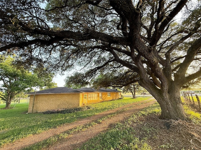 1002 Neiser Ln, Weimar, TX 78962 - view of property exterior featuring a lawn