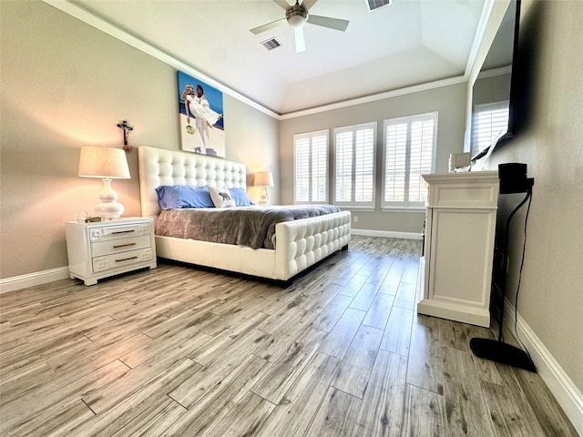 9723 Reston Ranch Ct, Cypress, TX 77433 - bedroom with light wood-style floors, baseboards, ornamental molding, a tray ceiling, and a ceiling fan