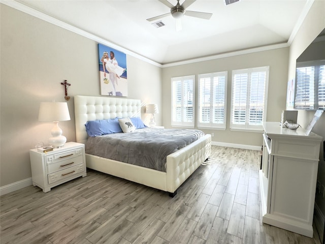 9723 Reston Ranch Ct, Cypress, TX 77433 - bedroom with a raised ceiling, light wood finished floors, crown molding, and baseboards