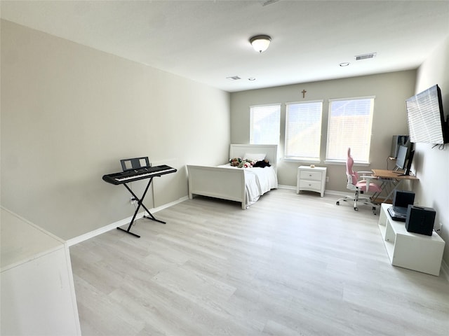 9723 Reston Ranch Ct, Cypress, TX 77433 - bedroom featuring light wood-style flooring, a desk, and baseboards