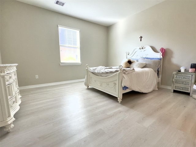 9723 Reston Ranch Ct, Cypress, TX 77433 - bedroom with light wood-style floors and baseboards