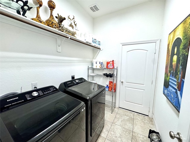 9723 Reston Ranch Ct, Cypress, TX 77433 - washroom featuring washing machine and dryer and light tile patterned flooring