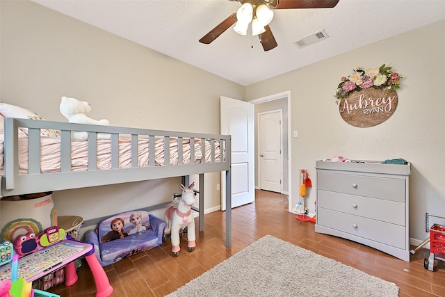 17202 Heritage Bay Dr, Webster, TX 77598 - bedroom with wood finished floors, baseboards, and ceiling fan