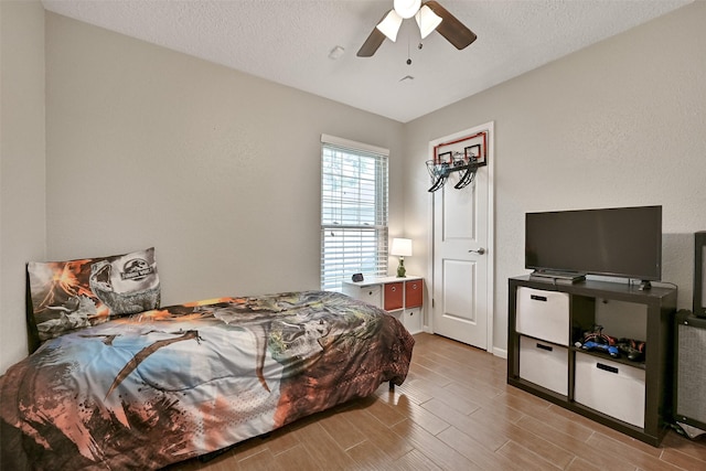 17202 Heritage Bay Dr, Webster, TX 77598 - bedroom with wood finished floors and ceiling fan