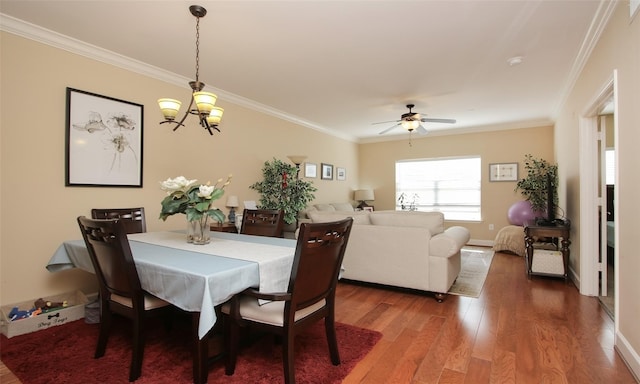2203 Dorrington St Unit 208, Houston, TX 77030 - dining space featuring wood finished floors, crown molding, a ceiling fan, and baseboards