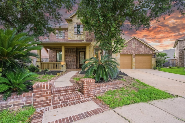 19014 Ridge Cove Ln, Cypress, TX 77433 - view of front of home with covered porch, concrete driveway, a garage, and brick siding